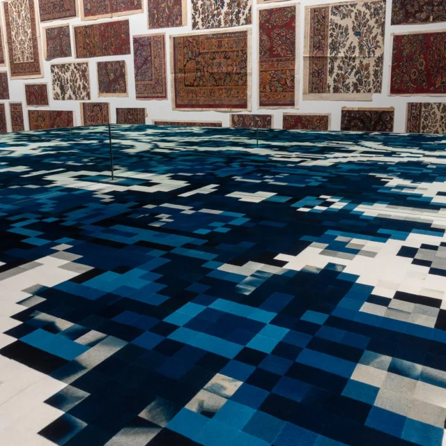 Woven Reflections: Reimagining the Karastan Archive, opens today and runs through December 4th at Kennesaw State University’s Emily Bourne Grisgby Galleries.  In addition to co-curating the exhibition with KSU’s Amanda Britton @abrittonstudio, I created two new works in response to the Karastan Archive, pictured here.

Karastan began at a moment of transformation. During the late 1920s, Americans were experiencing dramatic changes in work, technology, and daily life. As people moved away from agricultural labor and into an increasingly industrial economy, new technologies such as radio connected them to distant places and events in unprecedented ways. This expanding awareness of the wider world shaped cultural tastes and consumer desires, creating the conditions in which Karastan emerged in 1928 and introduced machine-woven interpretations of traditional Persian carpets to American audiences.

The Karastan Archive consists of approximately 2000 books covering some 200 years of design, textile, and carpet history, hundreds of hand-painted cartoons (weaving design drawings), design records, and other ephemera.  In our current moment of change and upheaval, the exhibition re-presents the archive as a means of looking back to look forward.

@zuckermanmuseum @ksucollegeofthearts @mohawkgroup